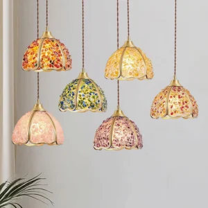 Multiple Beryl pendant lights in various colors hung together in bedroom residential space showing cluster installation