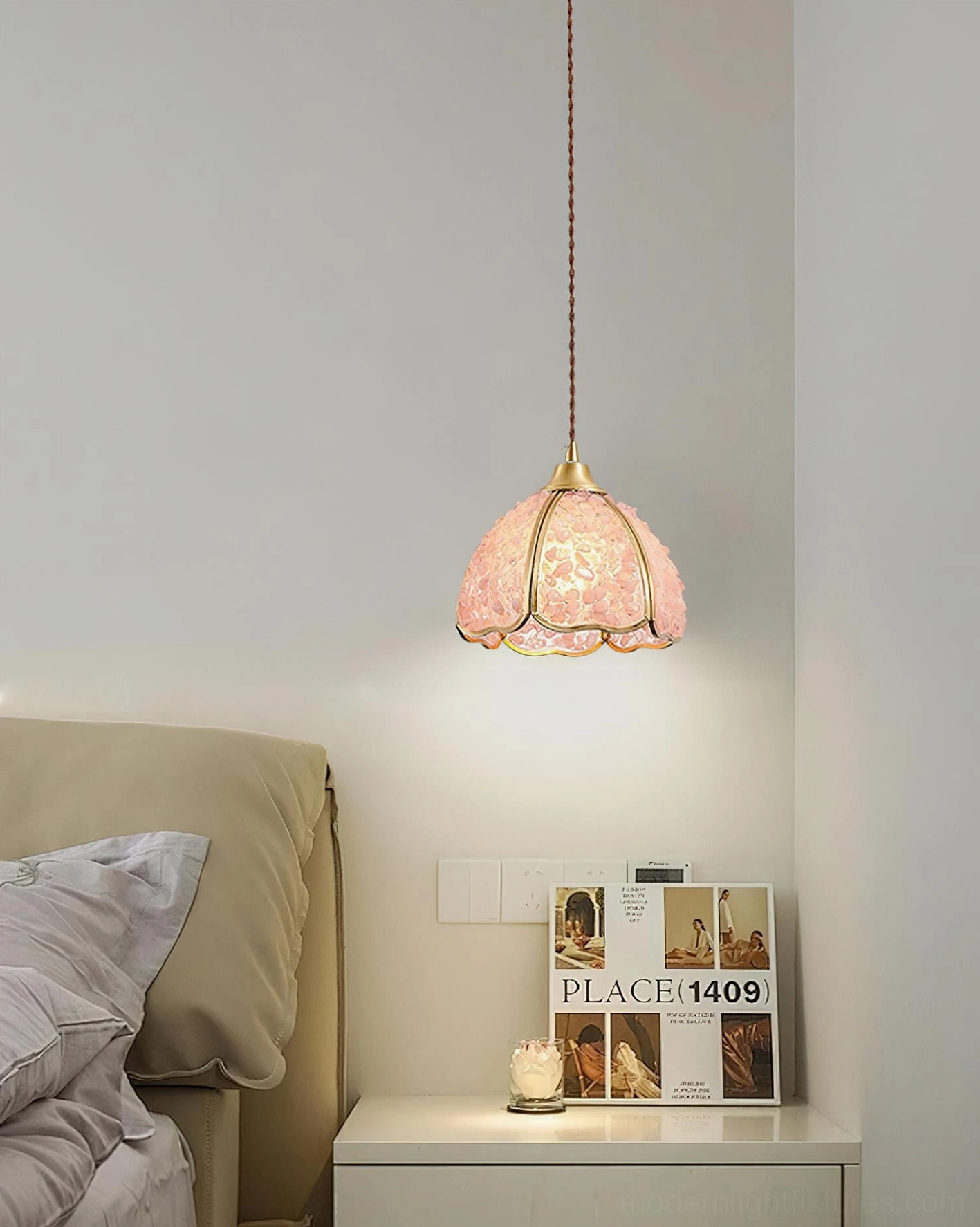 Pink Beryl stained glass pendant lamp hanging side view with warm ambient lighting over nightstand