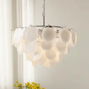 Modern Bettina disc glass chandelier three-quarter view illuminated in bright indoor space with sheer curtains