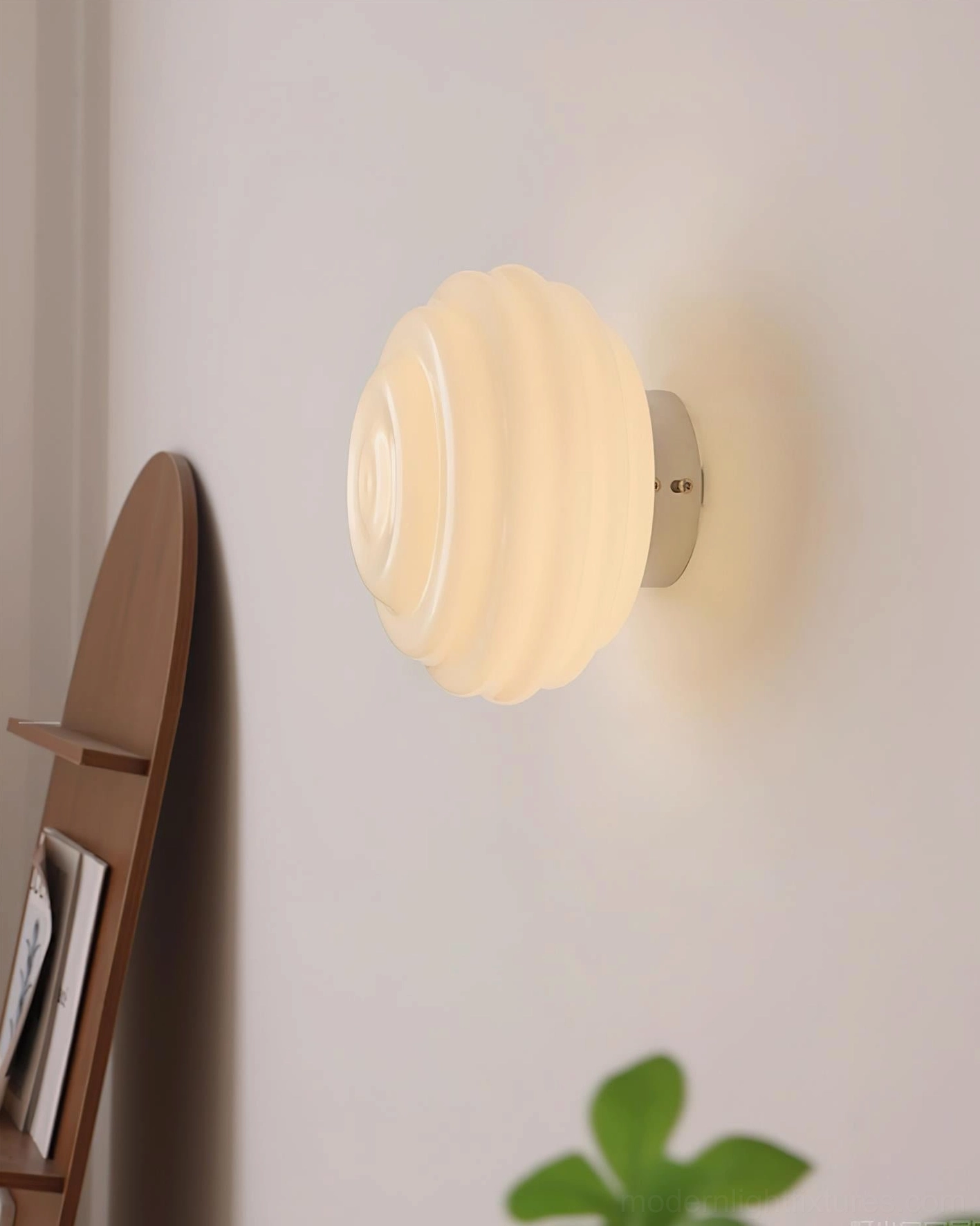 Beverly wall sconce chrome silver metal base soft warm ambient light side angle bedroom decor