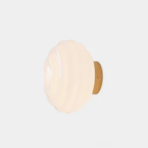Beverly ribbed glass wall sconce with brass gold finish - front close-up studio view