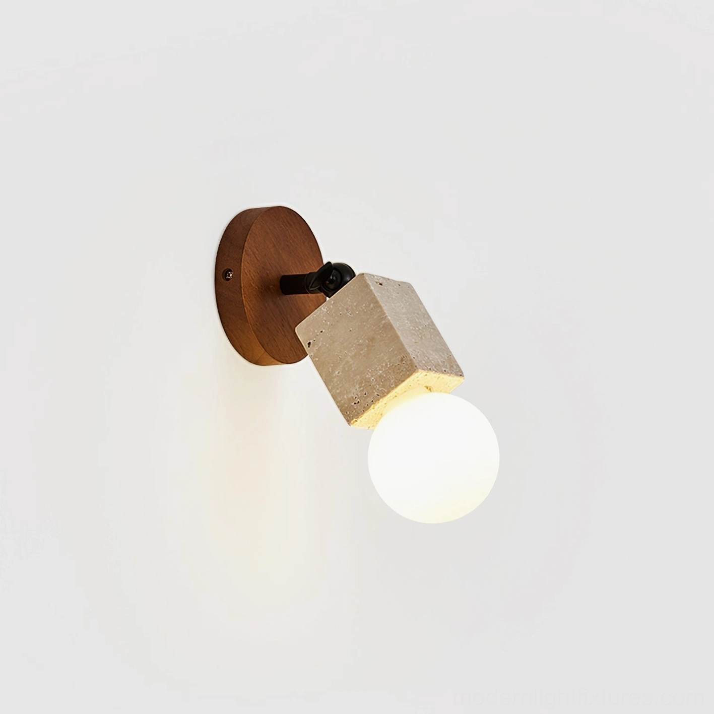 Bezel travertine wall light front shot on white background showing natural stone and wood details