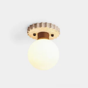 Bianca modern globe ceiling light with travertine textured base and frosted glass shade, front studio view