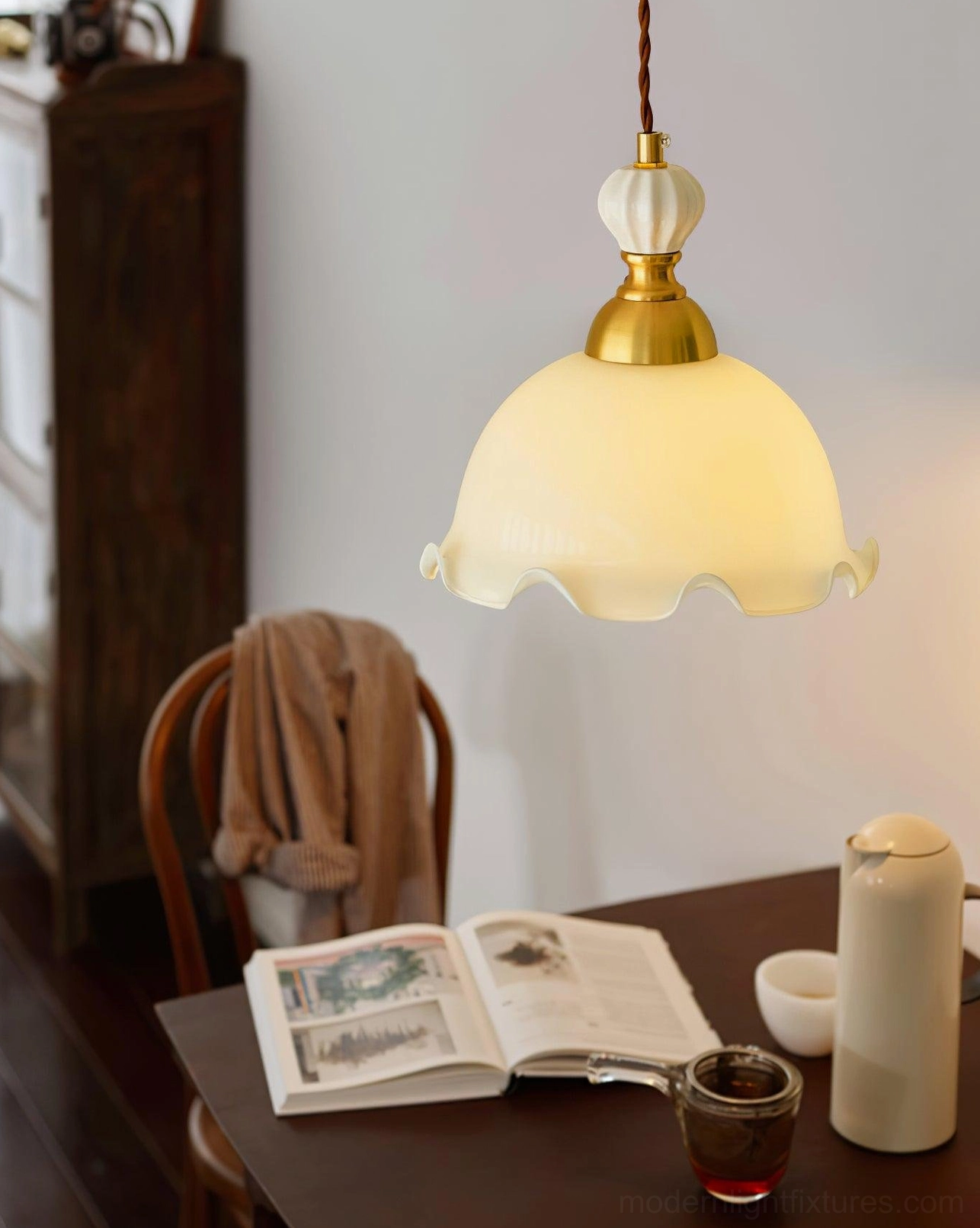Bianca white opal glass pendant fixture, brass metalwork detail, vintage-inspired hanging lamp close-up