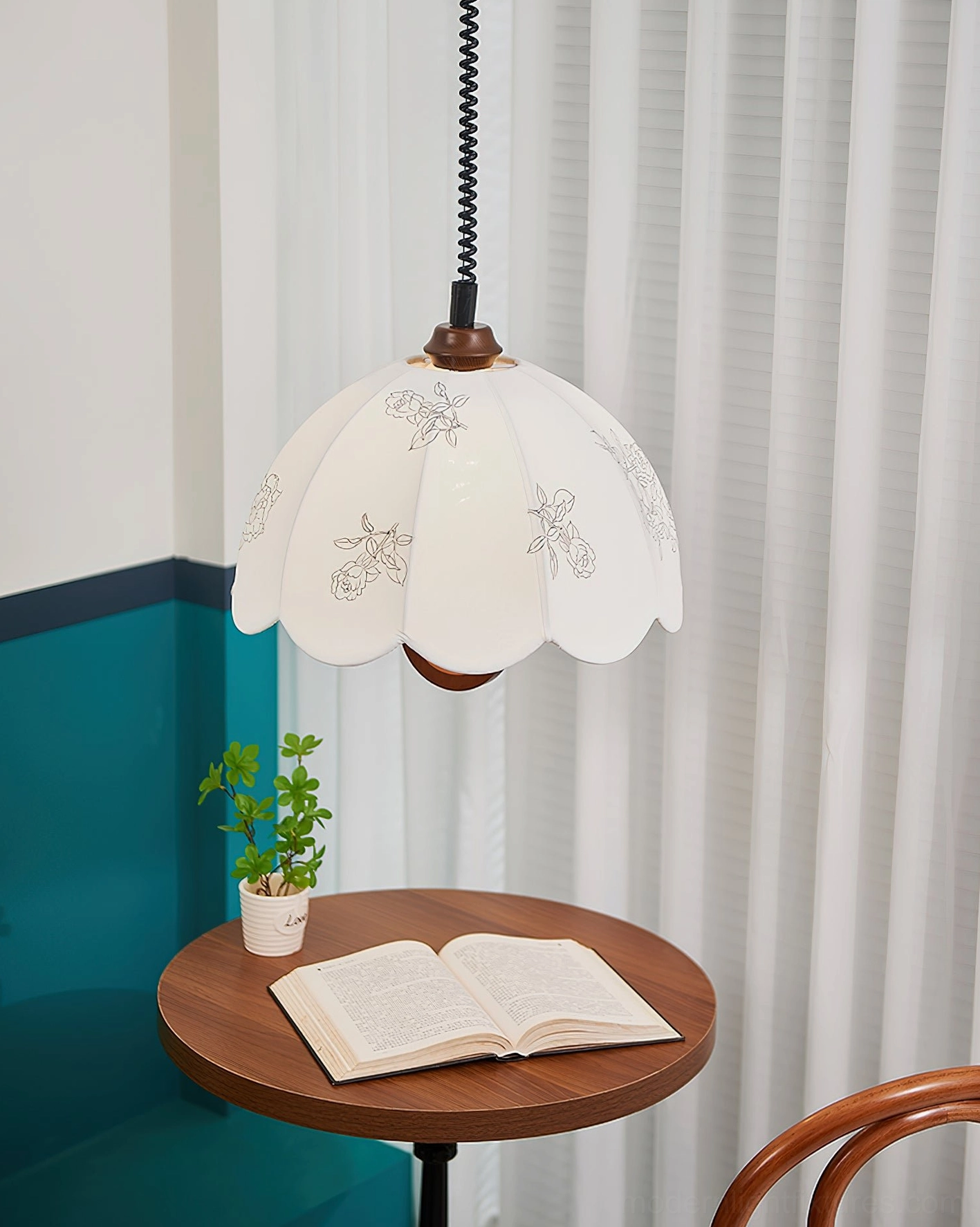 Binta scalloped pendant light low angle view with spiral cord teal accent wall