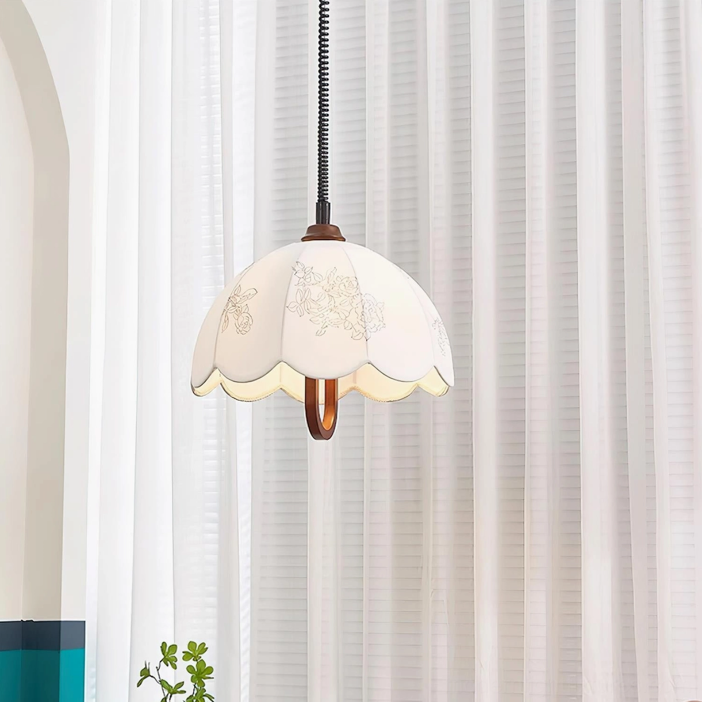 Binta fabric pendant light walnut and white color variant hanging in studio setting