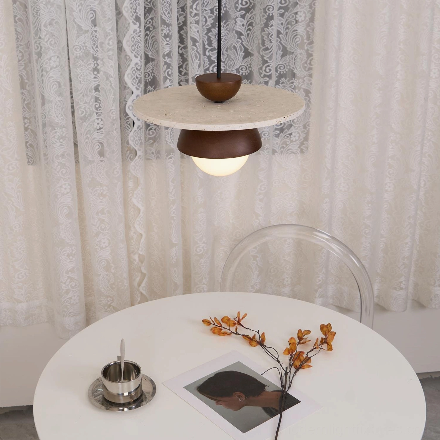Biophilic design pendant lamp combining travertine stone and frosted glass for natural interiors