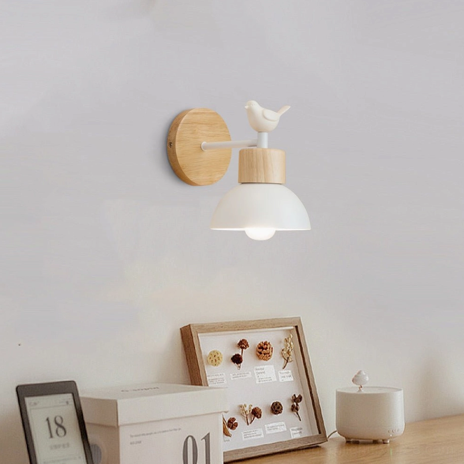 Bird wall lamp on tabletop display with decorative frames and boxes - minimalist home lighting decor