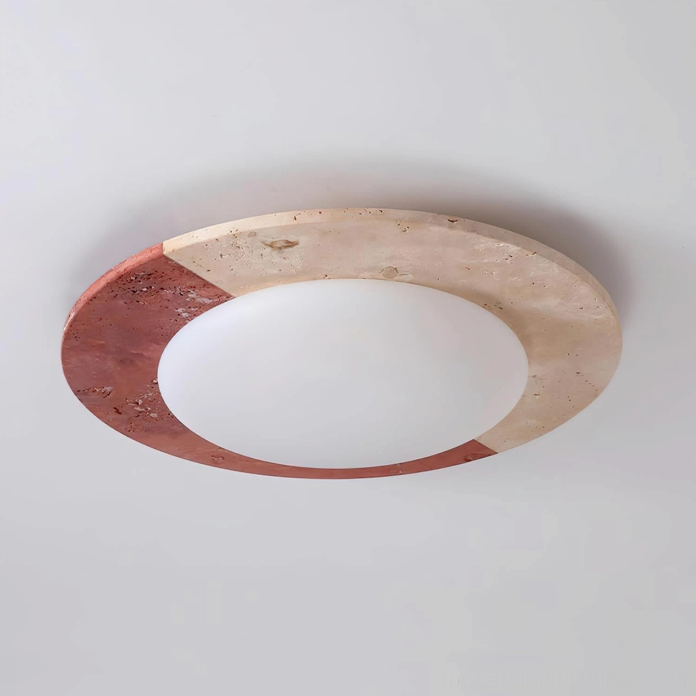 Bivora ceiling light close-up showing beige and red travertine stone craftsmanship and surface character