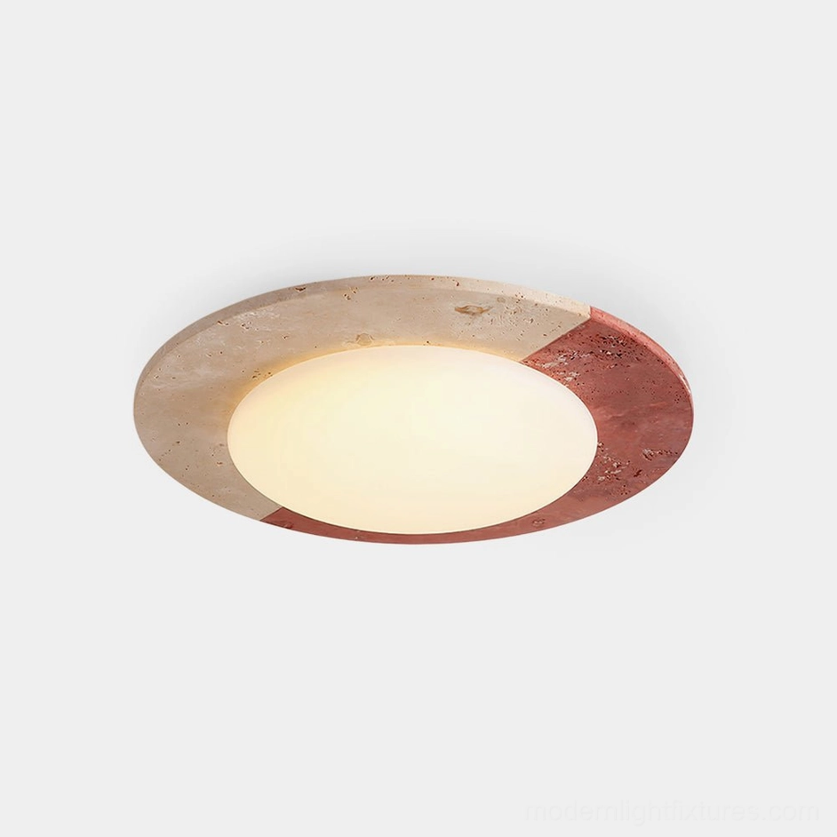 Bivora natural travertine round flush mount ceiling light with beige and red stone detailing and opal diffuser, front view on white background