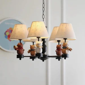 Black metal animal musicians chandelier with resin figurines and fabric shades displayed in modern interior setting