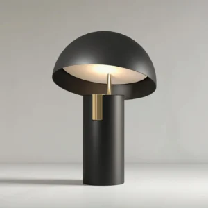 Black Avo LED table lamp with integrated mushroom dome design and brass detail, three-quarter front angle showcase