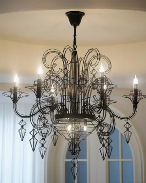 Black Baroque chandelier illuminated overhead view - matte black finish casting warm candlelight shadows