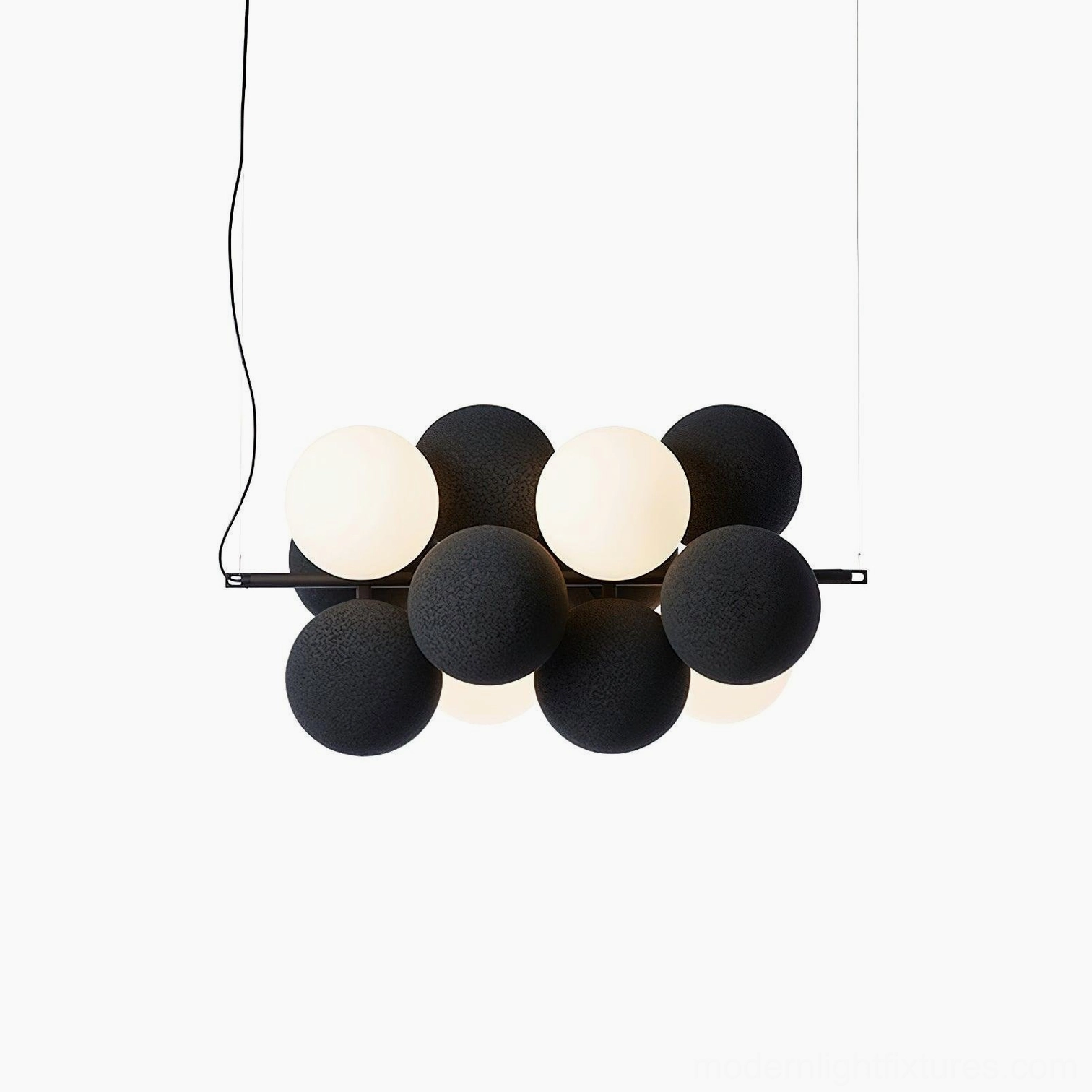 Black bubble pendant light with asymmetrical sphere clustering in modern minimalist interior