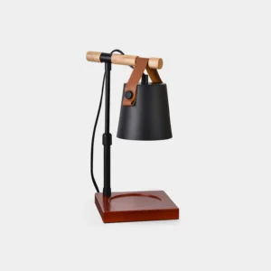 Black metal candle warmer lamp with reddish-brown wooden base and leather handle on white background, front view