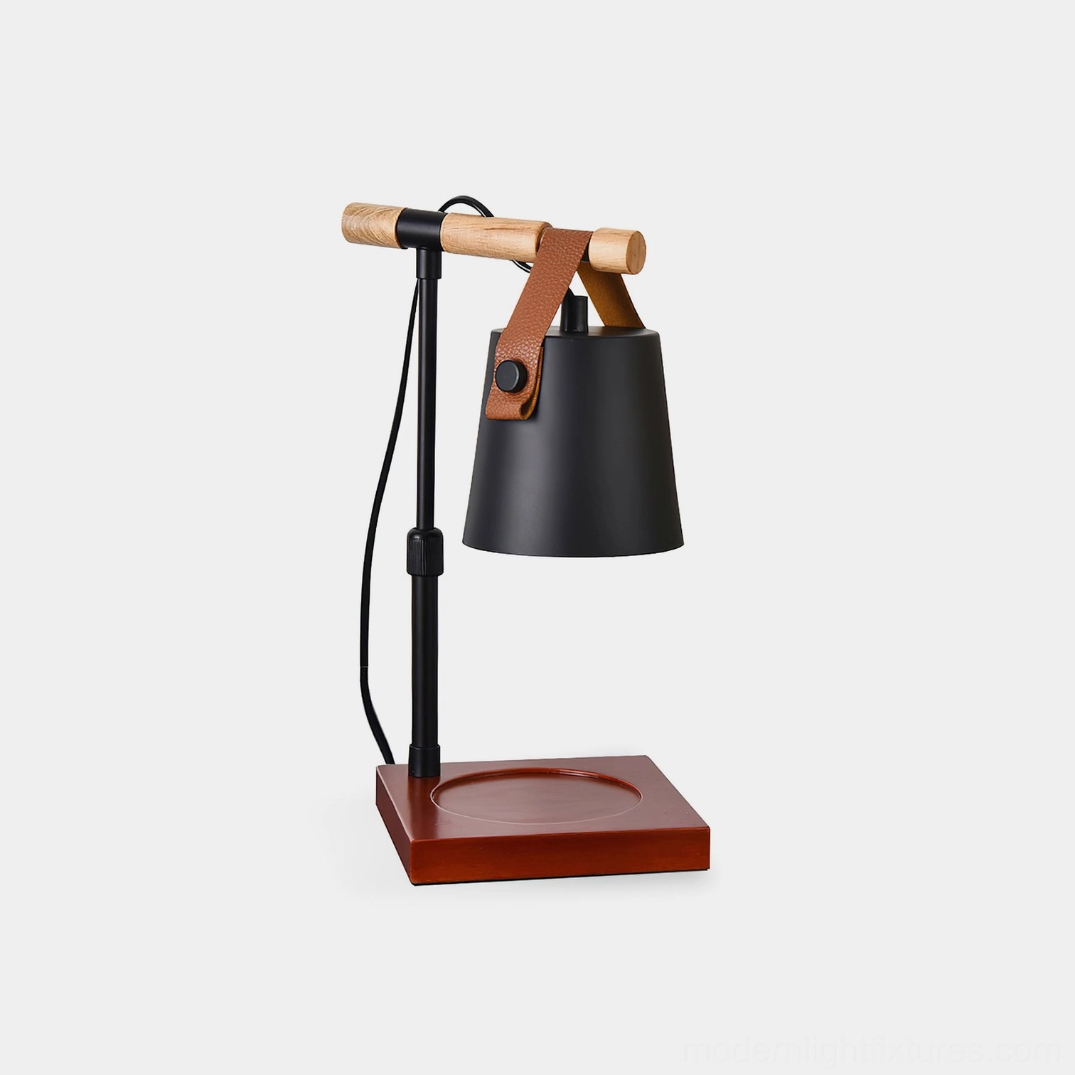 Black metal candle warmer lamp with reddish-brown wooden base and leather handle on white background, front view