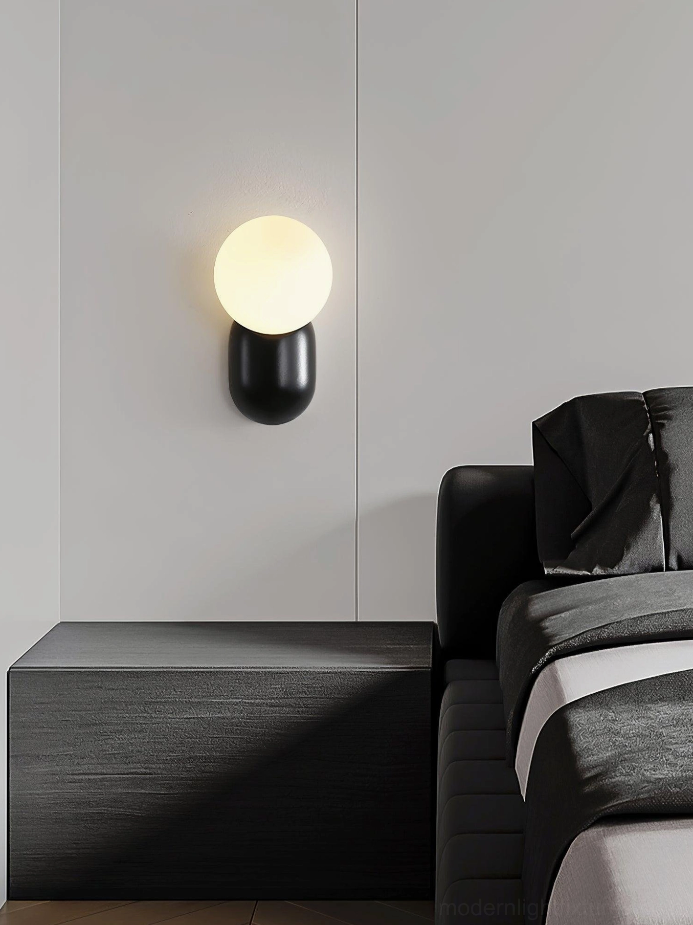 Black finish cantilever wall sconce creating dramatic accent in industrial-modern bedroom design