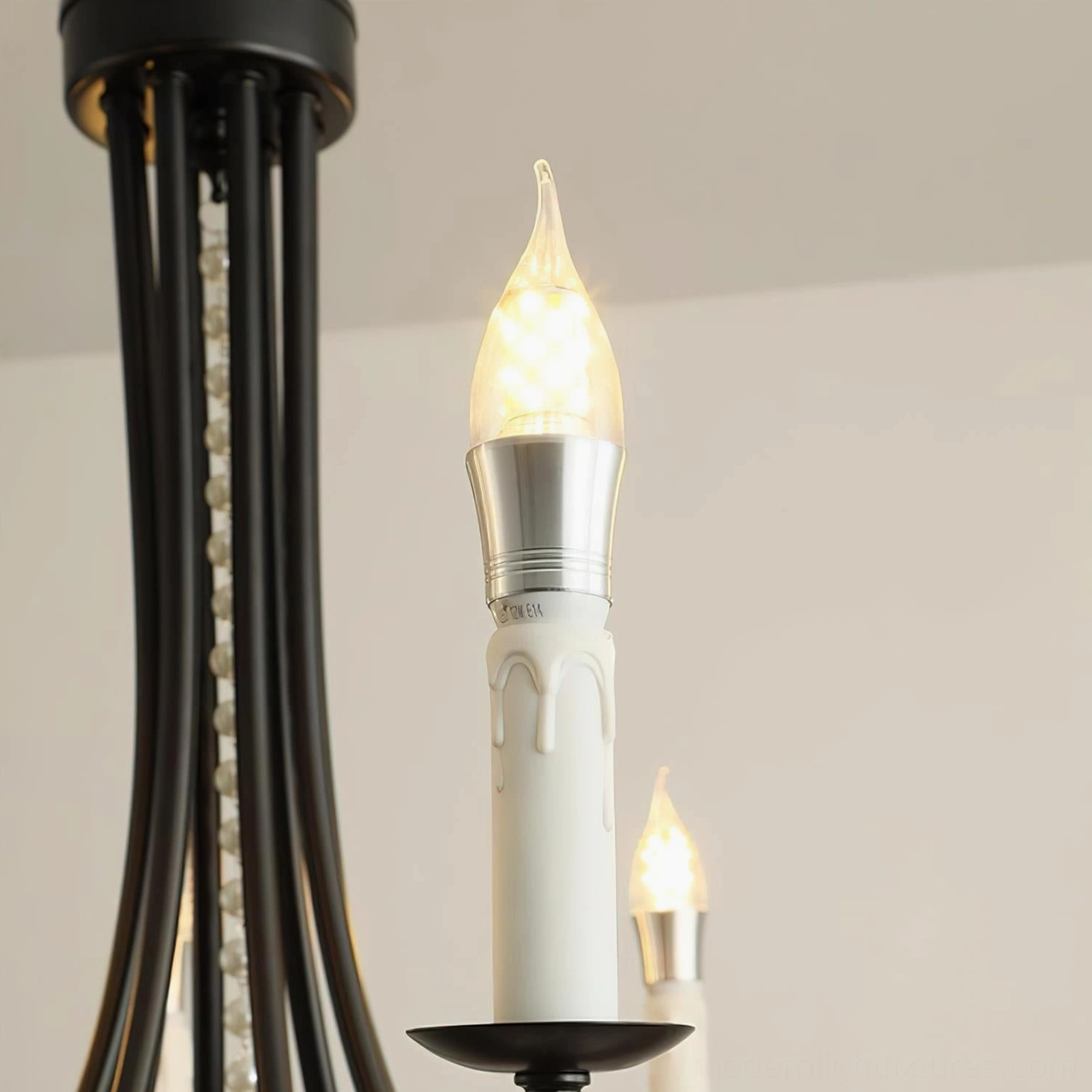 Black crystal chandelier detail featuring faceted black crystal drops and pearl bead decoration