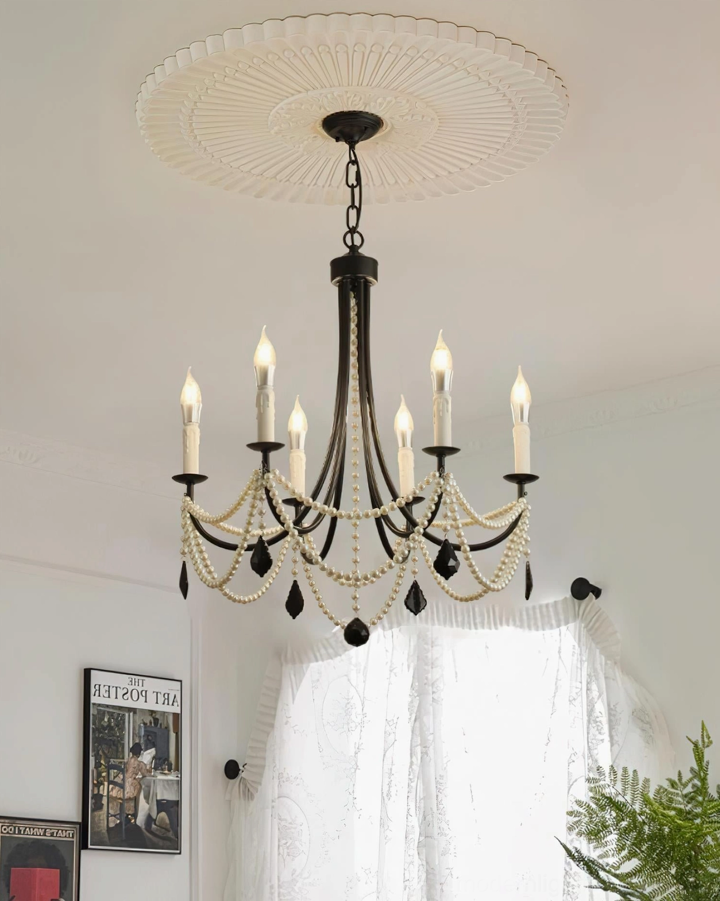 Black pearl beaded chandelier close-up detail showing matte metal arms and cascading faux pearl strands