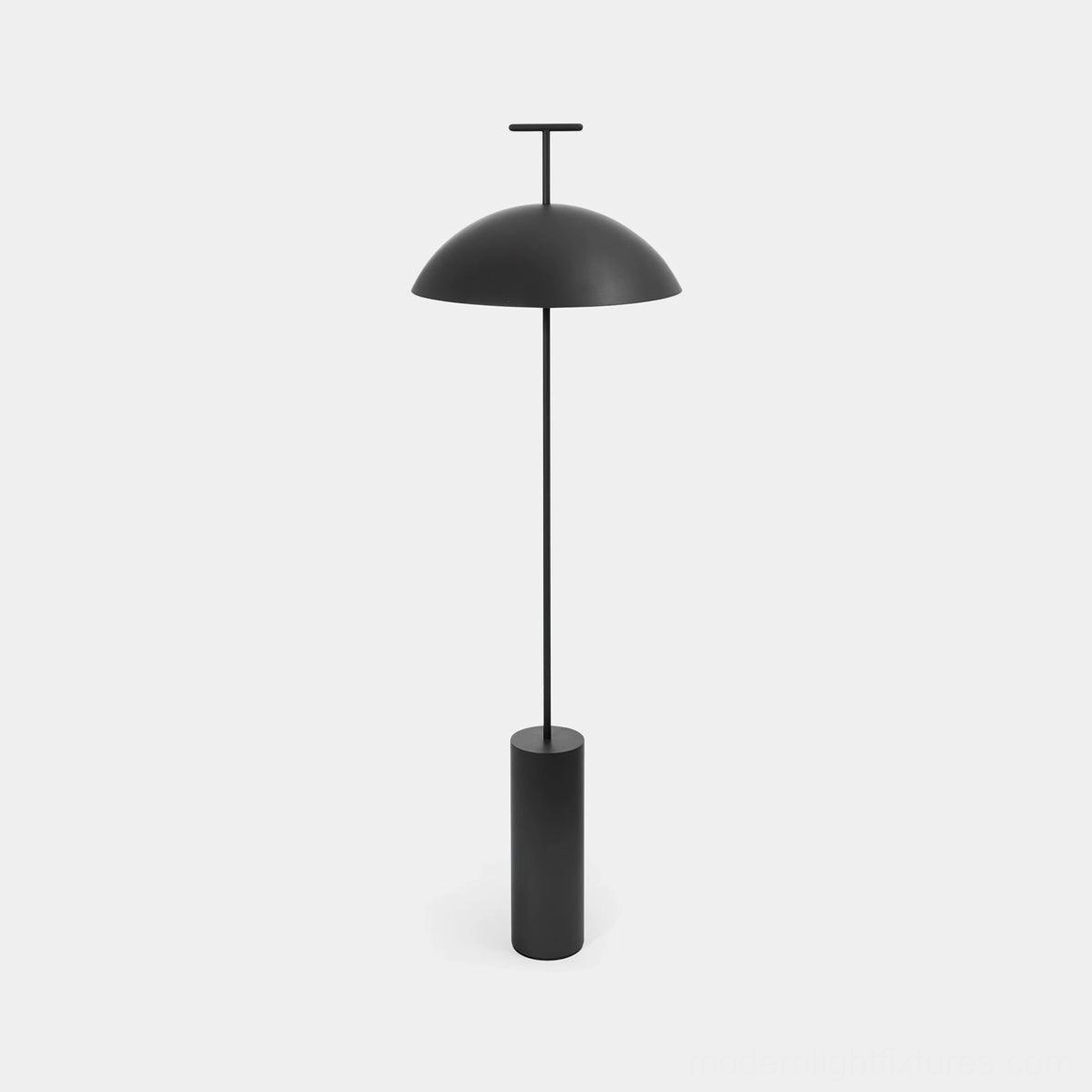 Matte black minimalist dome floor lamp with slender metal frame in studio setting
