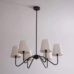 Black chandelier with 6 off-white tapered fabric shades mounted on ceiling, close-up detail view