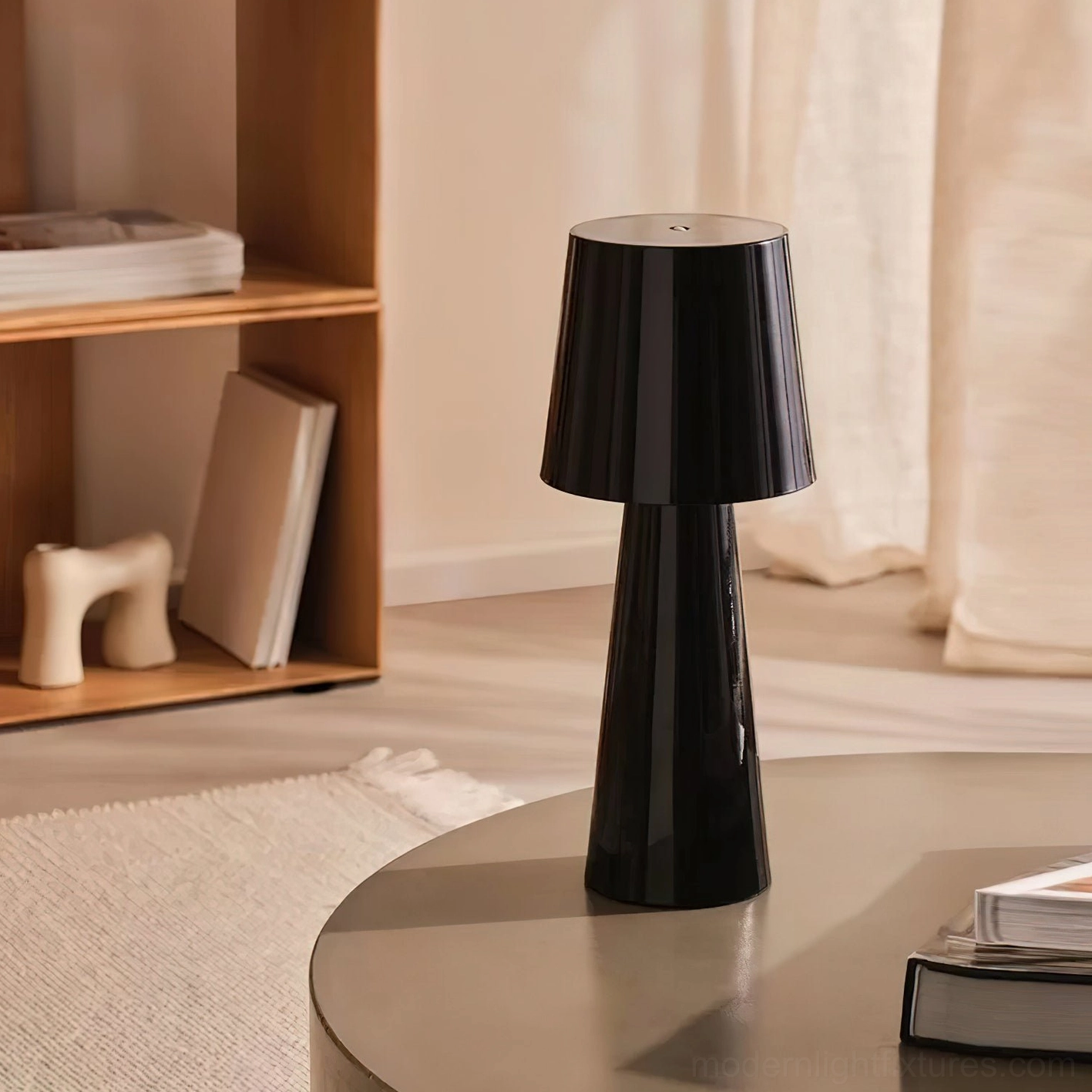 Glossy black modern tapered table lamp three-quarter view on contemporary coffee table