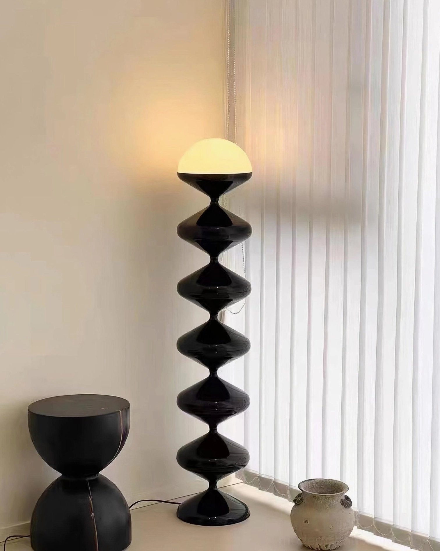 Modern black gourd floor lamp full height view in contemporary residential setting