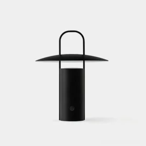Modern minimalist matte black LED table lamp with integrated carry handle on white studio background