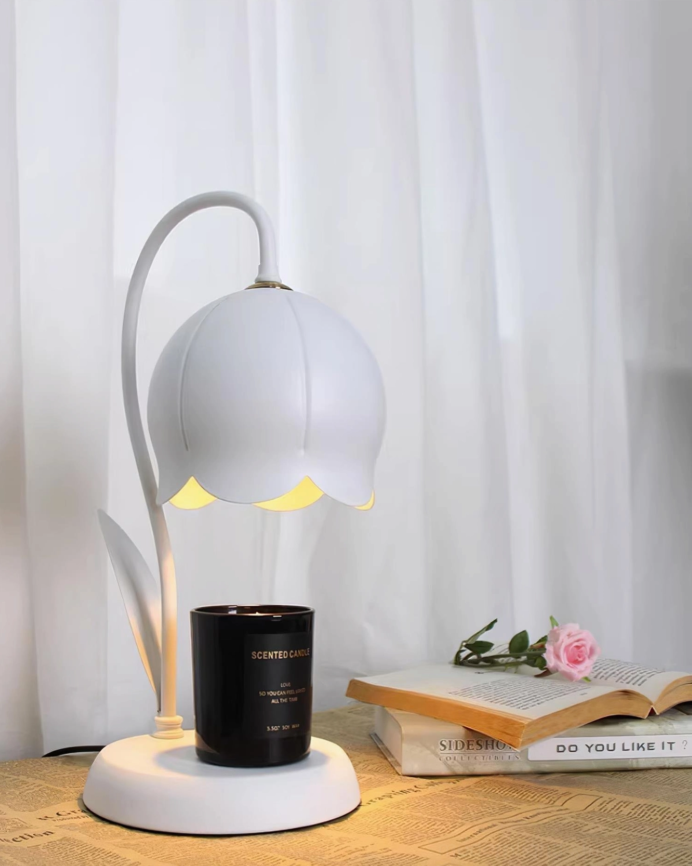 Black lily warmer lamp in modern minimalist interior with zen meditation space setup