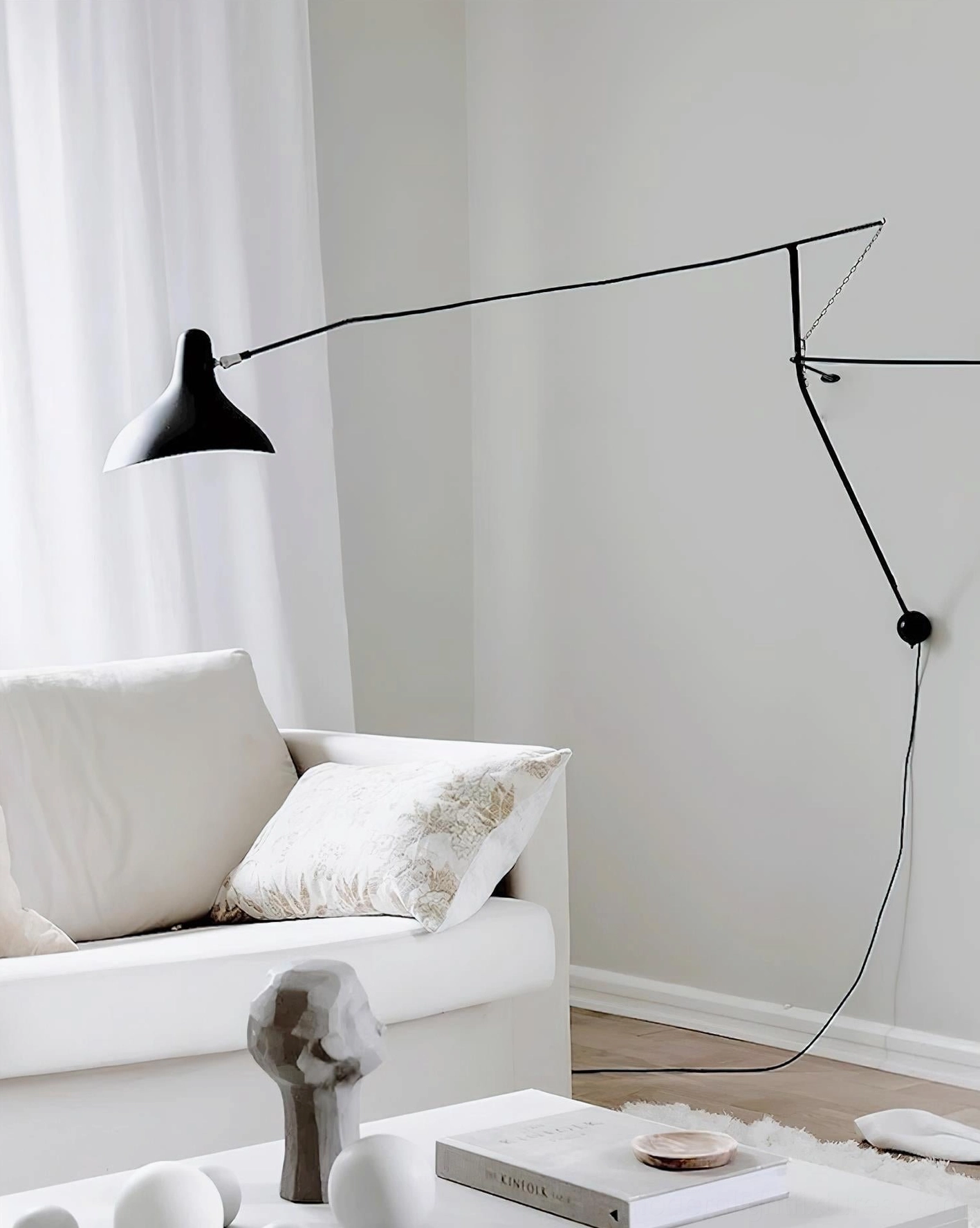 Articulating black mantis wall sconce accent lighting application