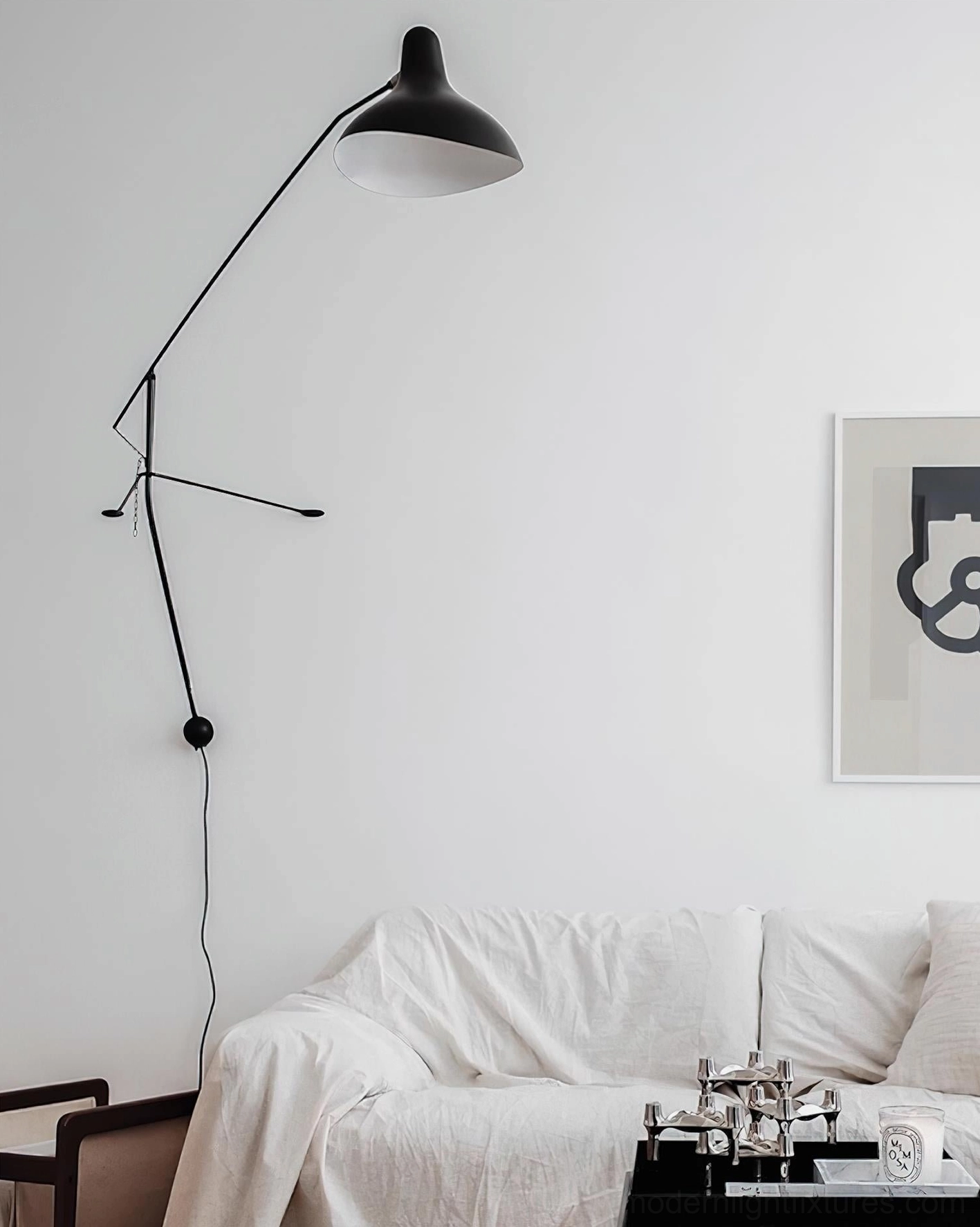 Black matte wall-mounted swing arm lamp design showcase