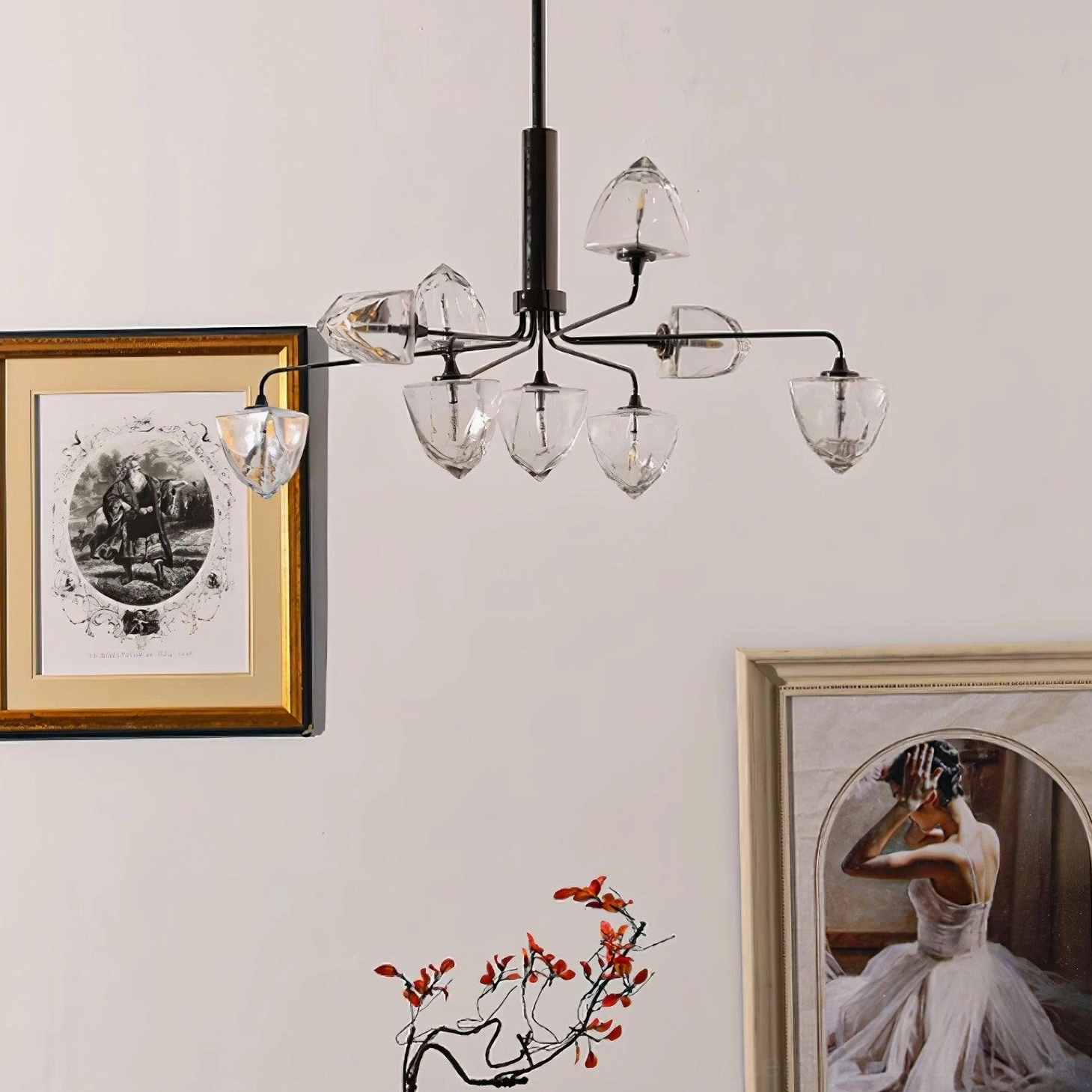 Black metal frame modern chandelier with clear faceted glass shades illuminated in living space