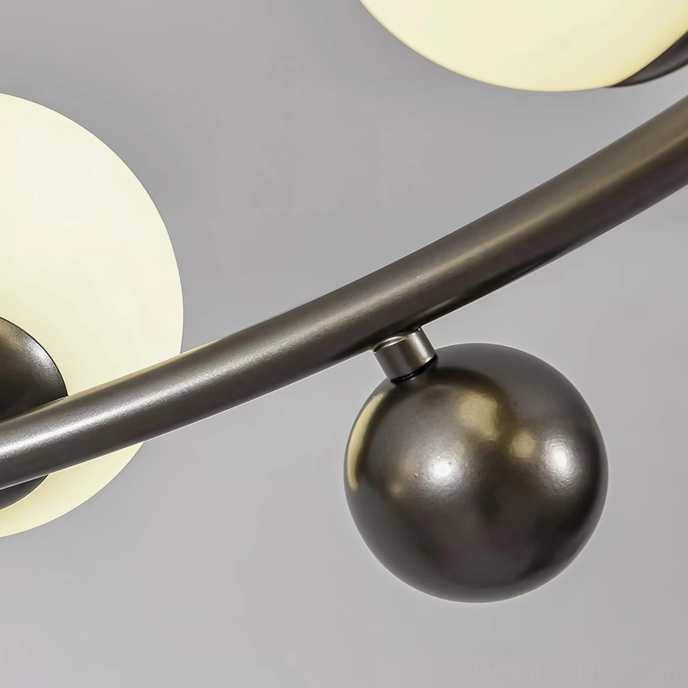 Black metal sputnik ceiling light fixture with frosted glass globes - premium modern lighting design detail