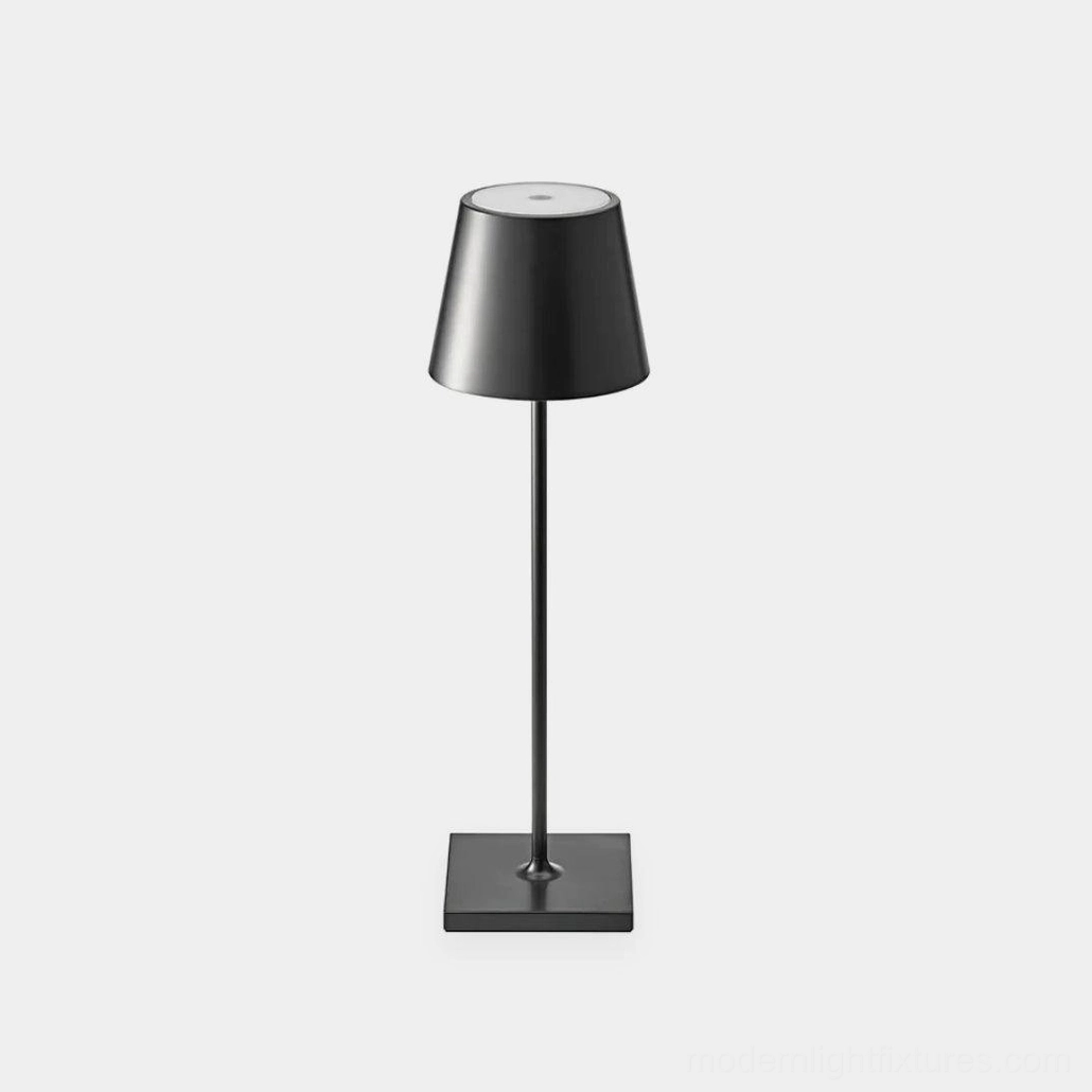 Black minimalist modern table lamp with tapered square shade and metal stem on white background