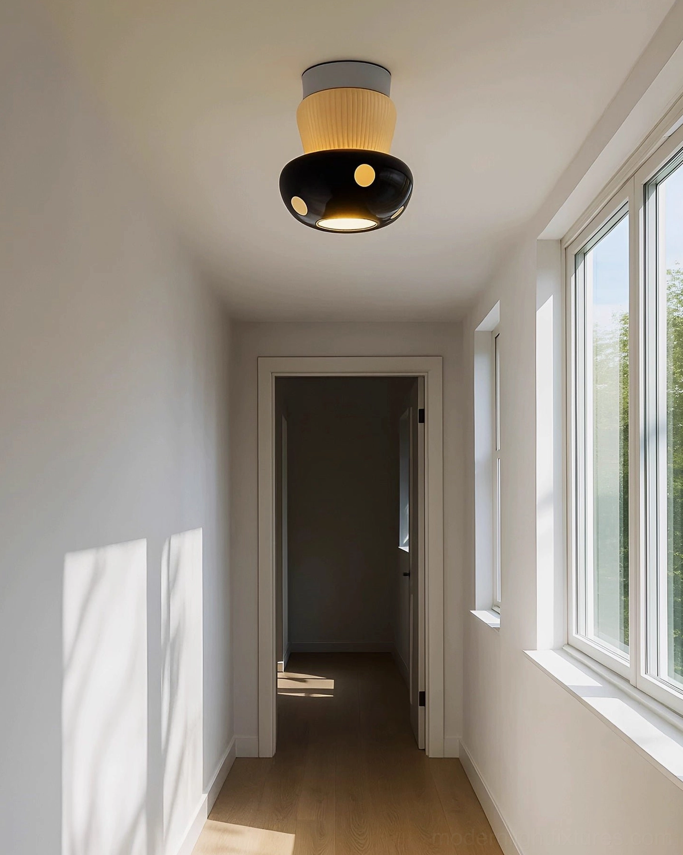 Black ceramic mushroom ceiling light fixture in neutral minimalist hallway with side windows
