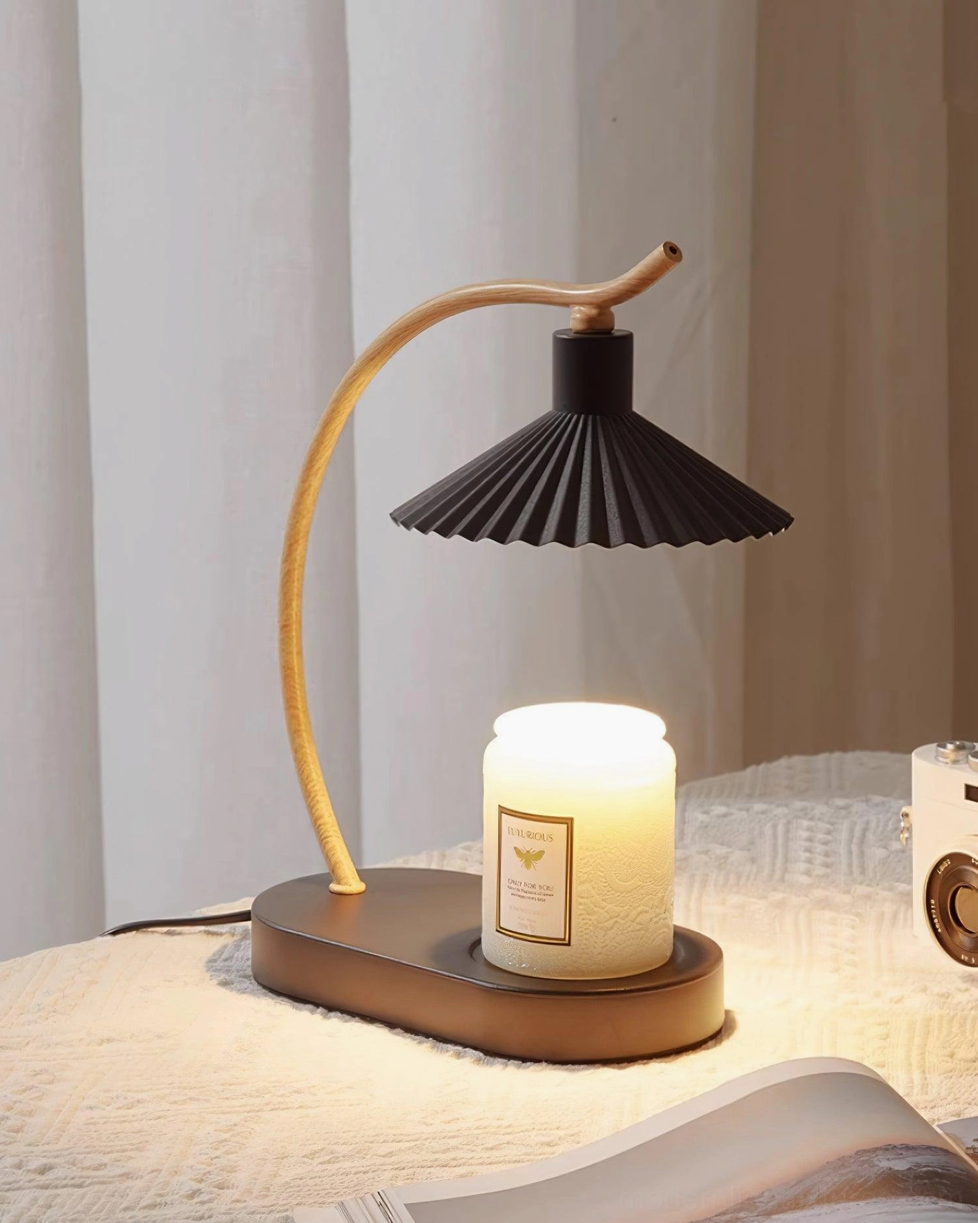 Black pleated shade table lamp with dark metal base styling detail