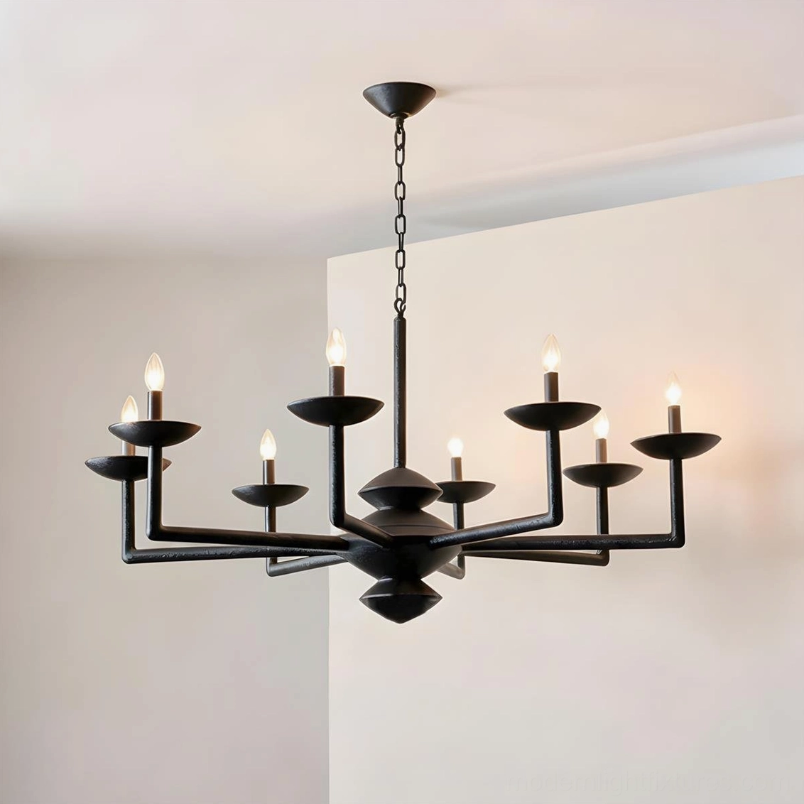 Black sculptural multi-arm chandelier three-quarter view, layered arm design in contemporary interior