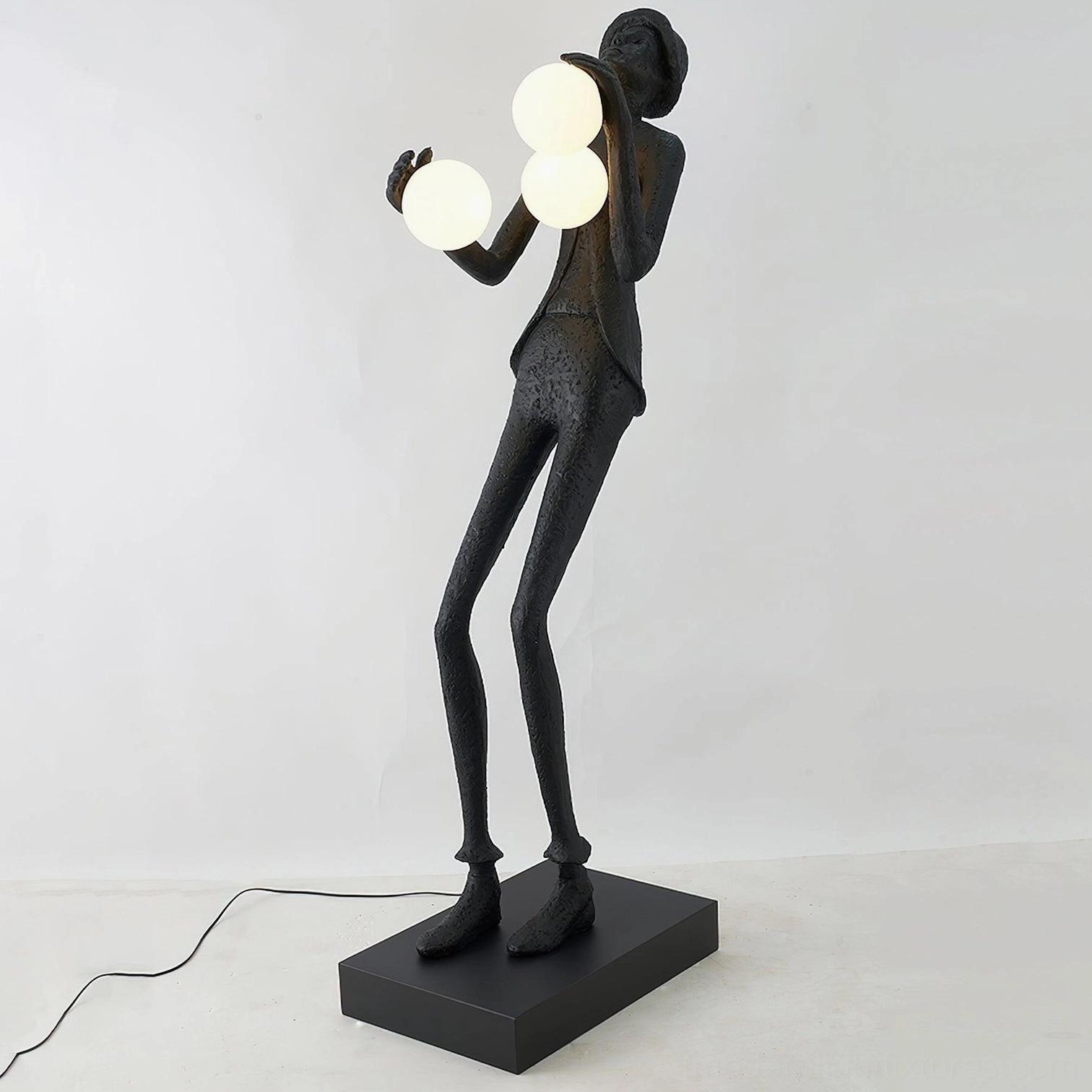 Black matte humanoid sculptural floor lamp with frosted glass lights sleek geometric base design