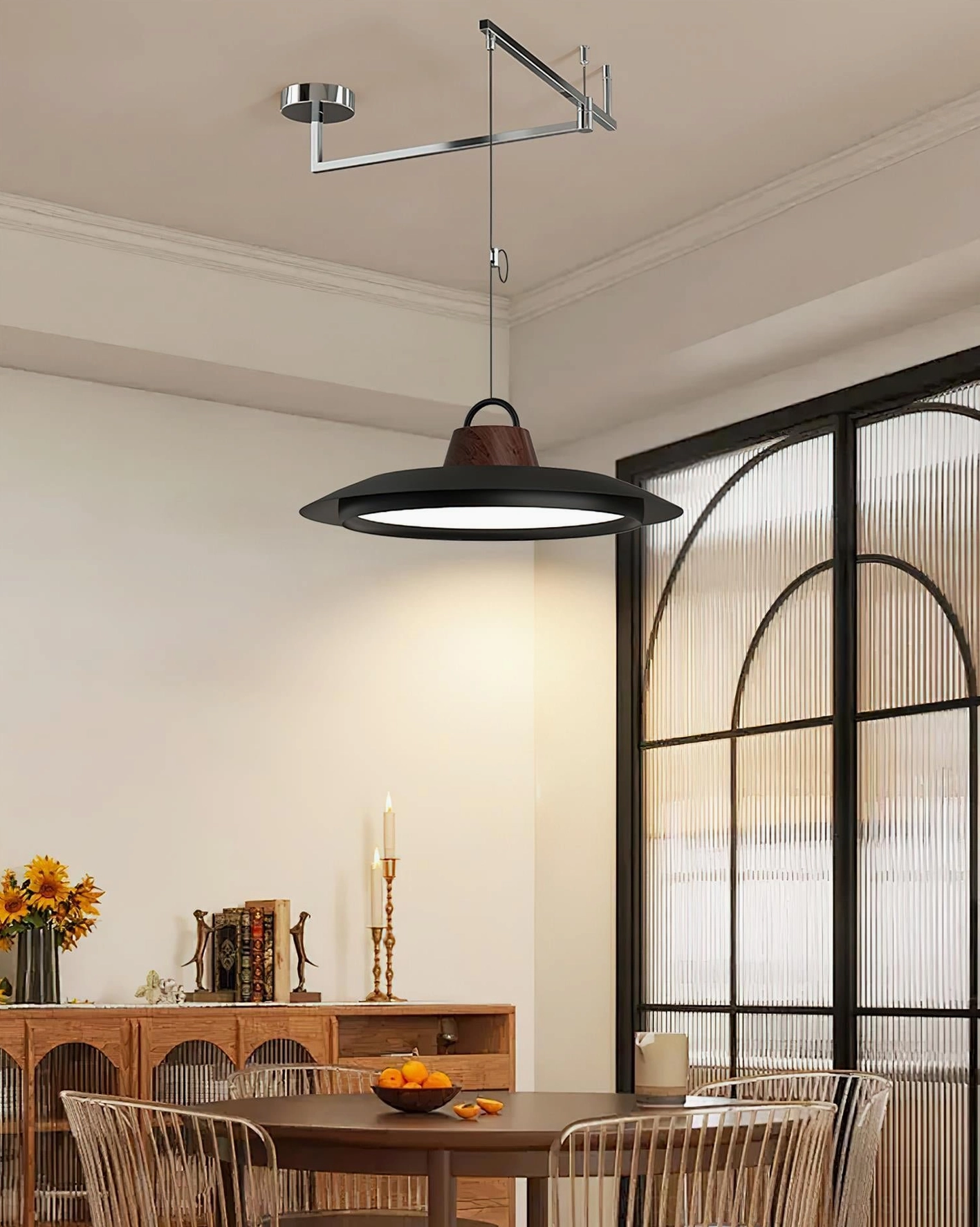 Industrial black swing arm pendant light with walnut wood detail in vintage-style dining space