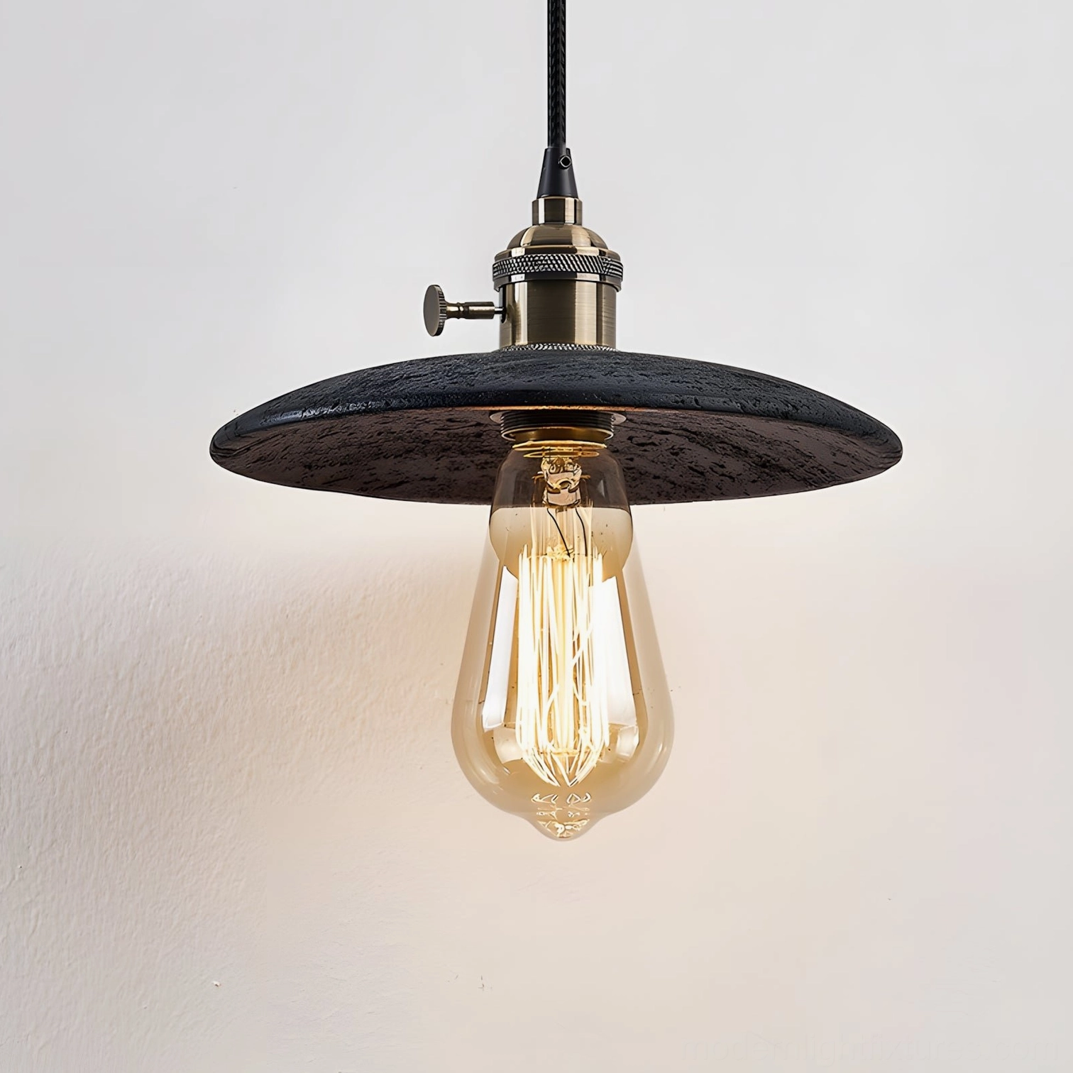 Black travertine pendant light fixture with dark stone shade and industrial metal hardware