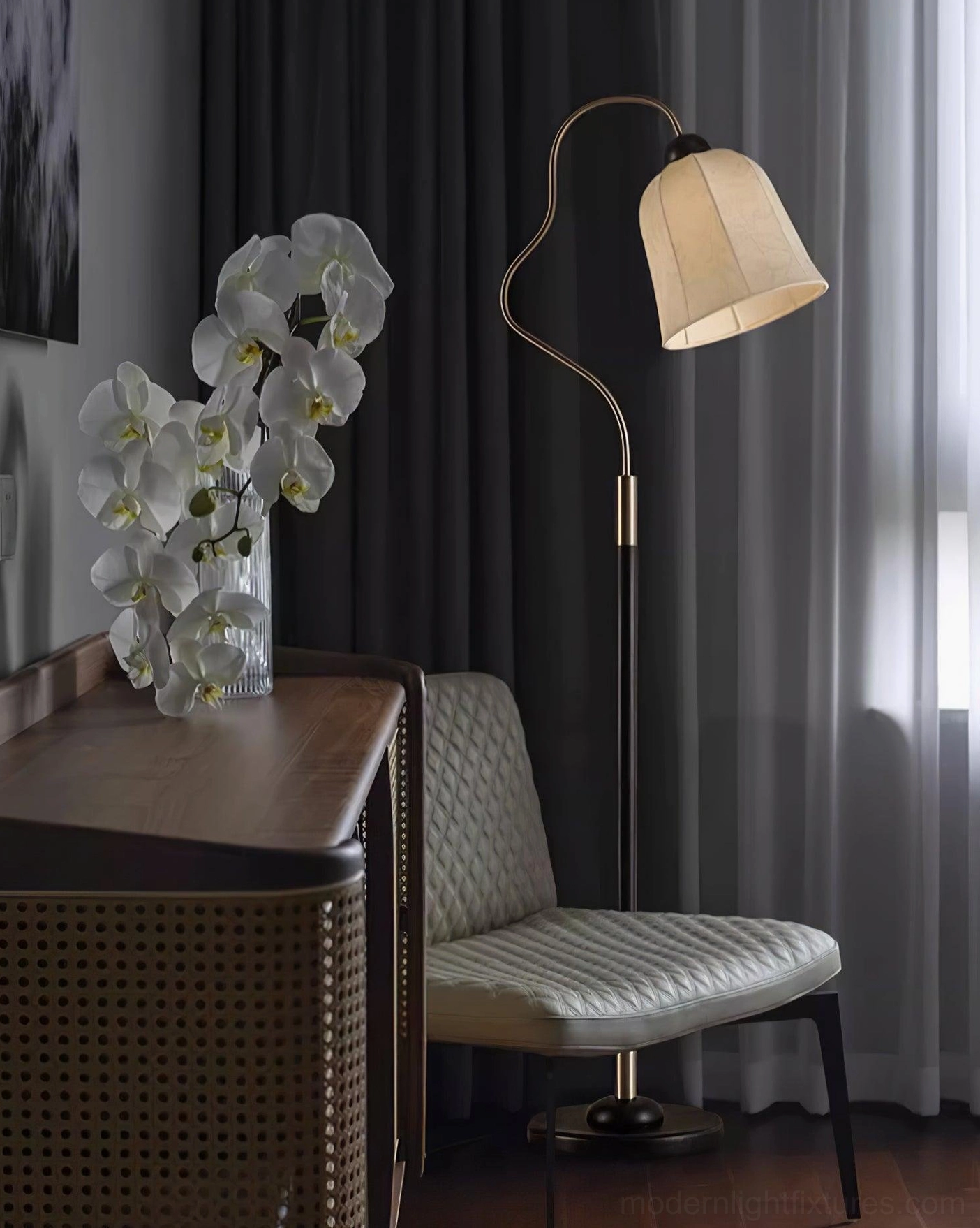 Black walnut mid-century arc floor lamp in eclectic interior with vintage and modern furnishings