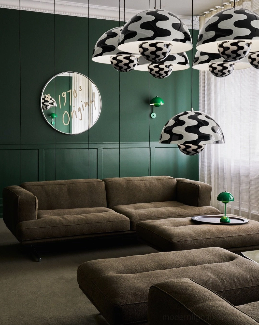 Black and white geometric patterned dome pendant chandelier installed in modern residential living room with bold graphic design shades
