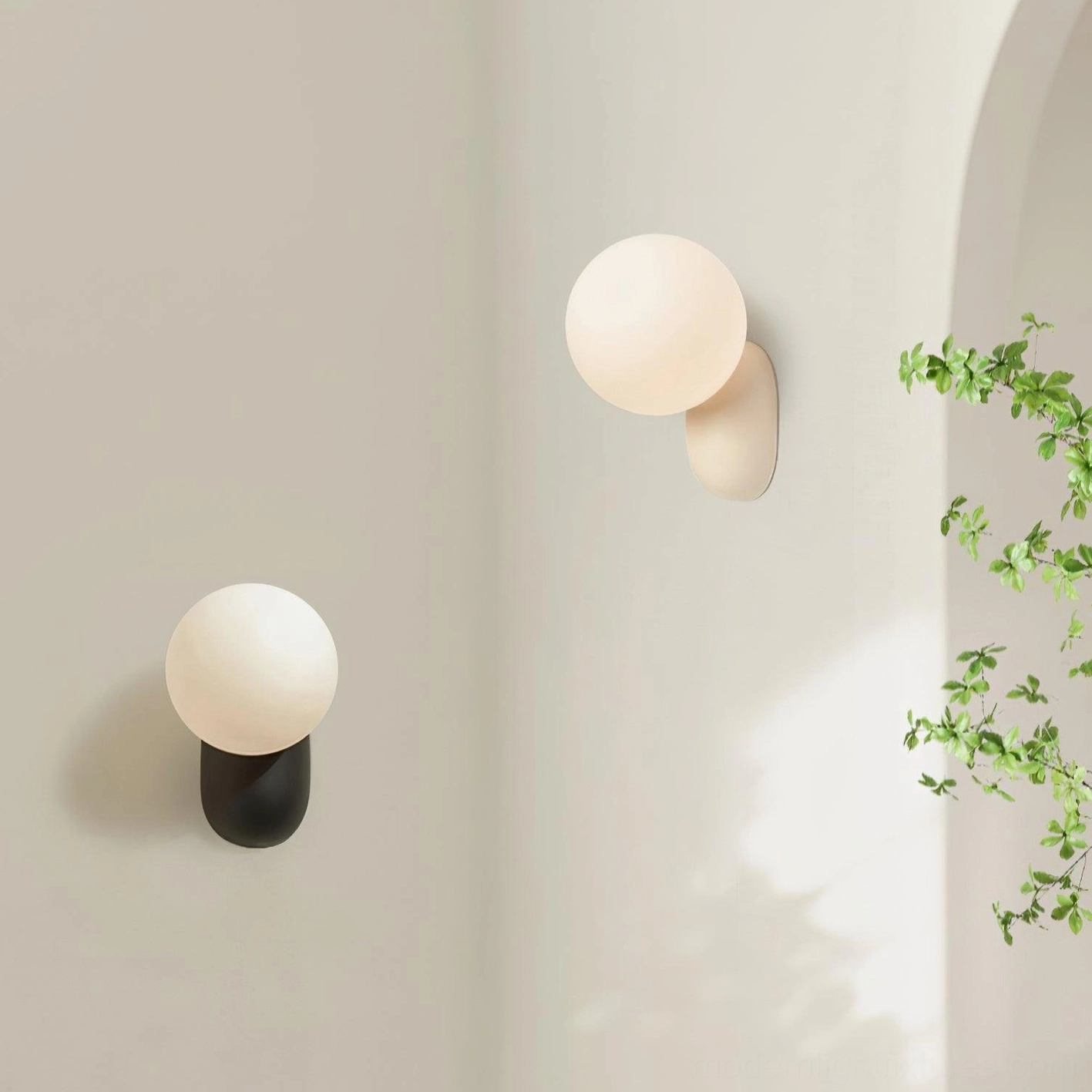 Two modern wall sconces in black and off-white finishes flanking archway corner, contemporary bedroom scene