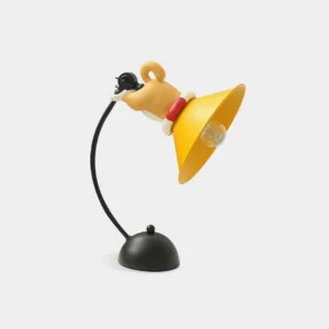 Playful black and yellow corgi table lamp with flexible gooseneck design, front view on white background showing modern cartoon desk lighting
