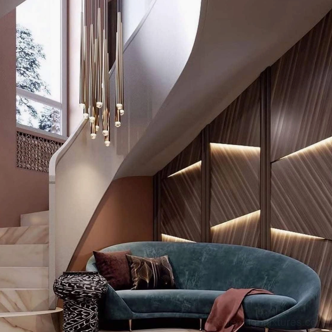 Dark blackened brass pendant chandelier in duplex stairwell with bronze finish