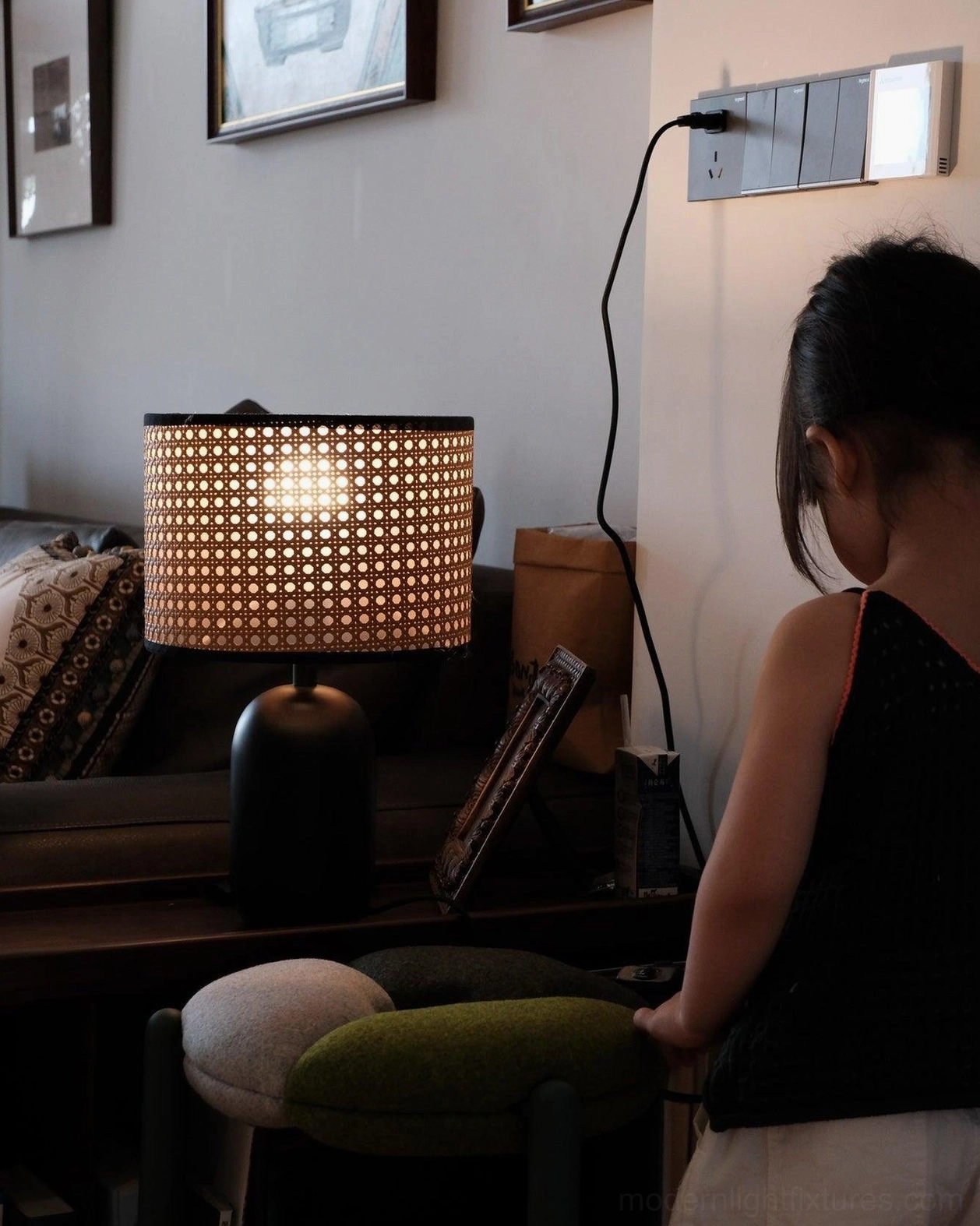 Blakely lamp matte black base grounding bohemian rattan shade design