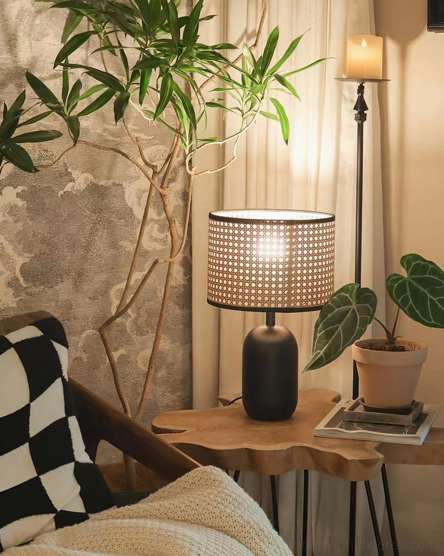 Blakely rattan table lamp with warm golden glow diffusing through woven shade