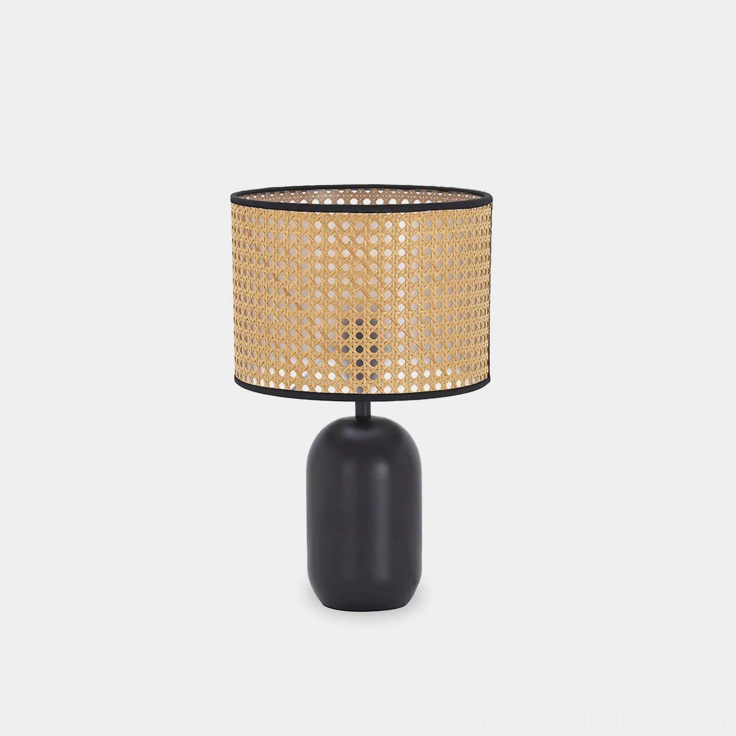 Blakely rattan table lamp front view with woven shade and matte black base on white background