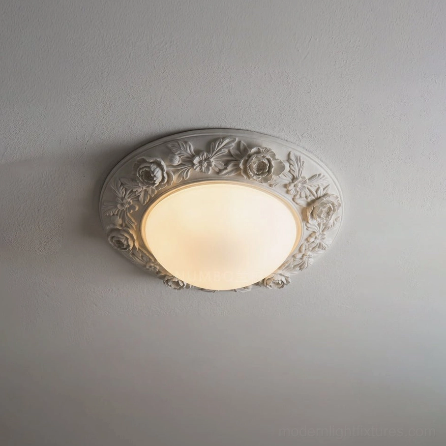 Blancora ceiling light in classic white finish showing hand-carved rose-and-leaf border and frosted glass dome, maintenance-free LED