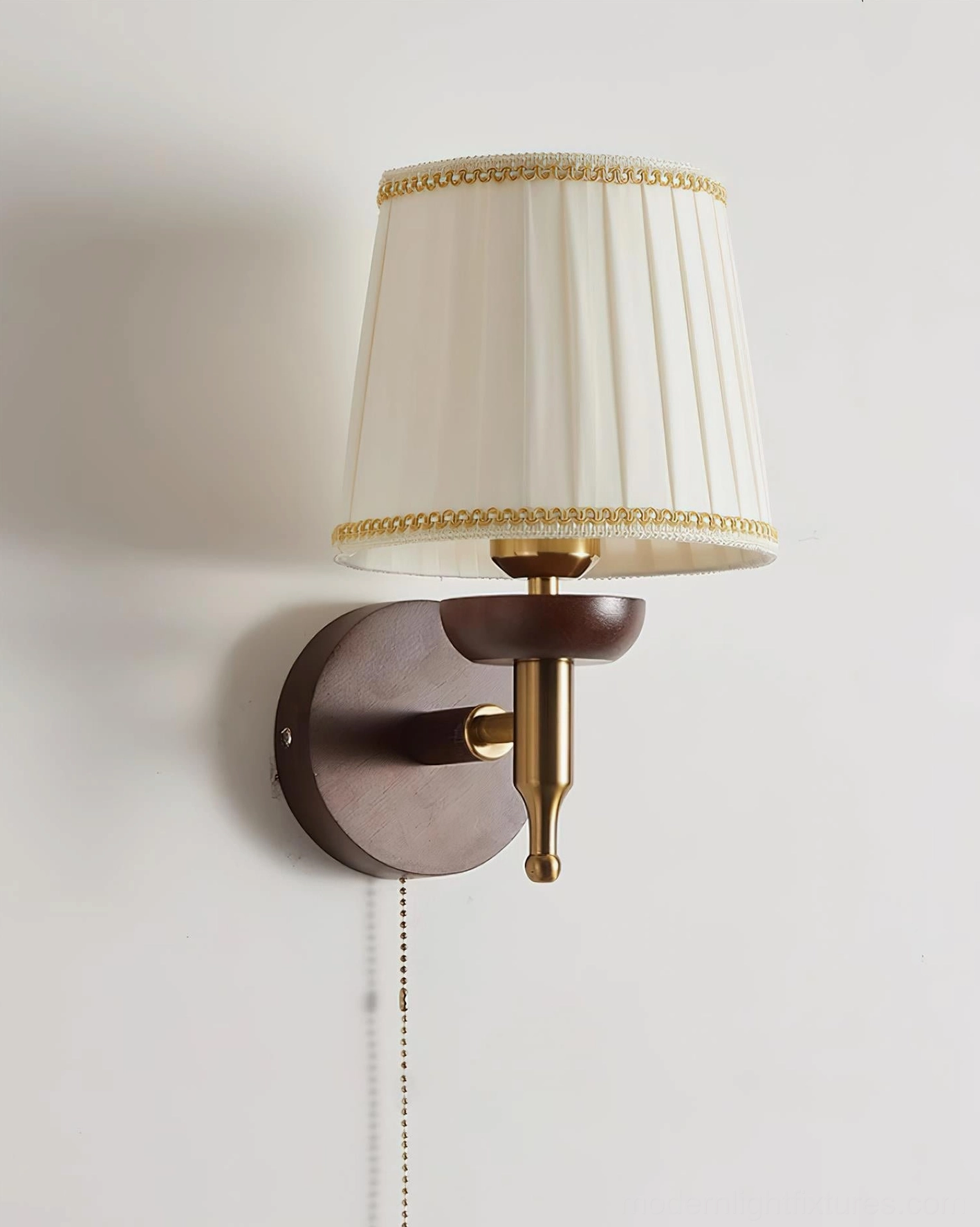 Modern Blixen wall sconce with pleated fabric shade and walnut wood mounting bracket